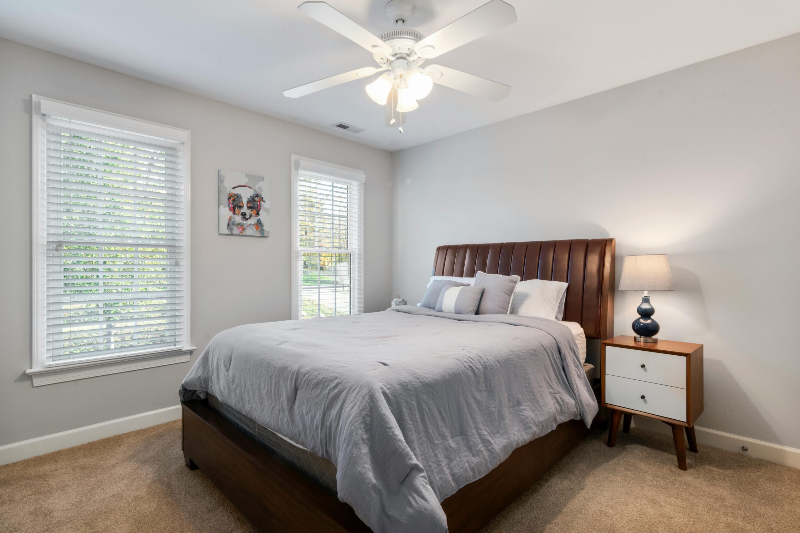 Elegant bedroom featuring a king size bed and minimalist design for a serene atmosphere.